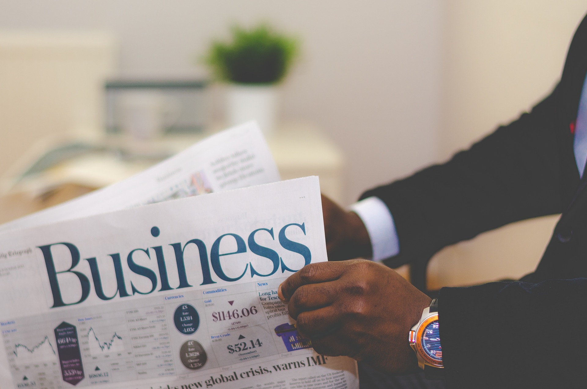 free publicity for your small business Business man holding newspaper with the title of BUSINESS